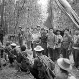 Like Mok, So Phim won his spurs as an Issarak guerrilla chief, fighting the French in the late 1940s. He was born into a peasant family in Eastern Cambodia, sometime in the 1920s (the year 1925 is often cited, but is no more than a guess). In August 1951, he became one of five founding members of the Vietnamese-inspired PRPK. Three years later, after the Geneva peace accords ended the first Indochina war, he was named to the four-member provisional committee which headed the party.<br/><br/> 

In 1960, Phim was elected an alternate member of the new CPK Standing Committee, and, three years later, a full member, ranking fourth or fifth in the party leadership. From 1960 until his death in 1978, he headed the CPK Eastern Zone Committee. He is described as 'a round-faced, stocky man, about 1.8 meters tall, with dark brown skin and straight black hair'. Like Ta Mok, he is portrayed as a crude willful man and, when in a rage, would threaten his colleagues with his pistol. But he was well-liked by his men, and had a (perhaps undeserved) reputation in the party as a moderate).<br/><br/>

A terrible repression on the Cham (Muslim) population was conducted in his zone, particularly in Kompong Cham province after the Cham’s refused to follow Khmer Rouge rules. In 1978, after eastern zone troops had failed to resist a large-scale Vietnamese army incursion – launched by General Giap as a warning to Pol Pot to halt cross-border raids and atrocities – Pol Pot began to suspect (probably falsely) that Phim was in cahoots with the leadership in Hanoi. He ordered a massive purge of the Eastern Zone.<br/><br/>

Phim, who at first refused to believe that Pol could have turned against him, was able to escape with his family and a small group of followers. Surrounded by Pol Pot’s forces, he committed suicide. His wife and children were captured as they prepared his body for the Buddhist funeral rites. They too were killed. He was replaced in his zone by Nuon Chea.